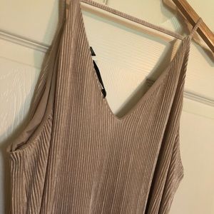 Absolutely stunning neckline, and a beautiful peach champagne color.